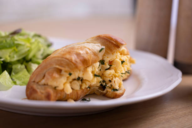 istock Breakfast plate with croissant stuffed with scrambled egg 2161825800