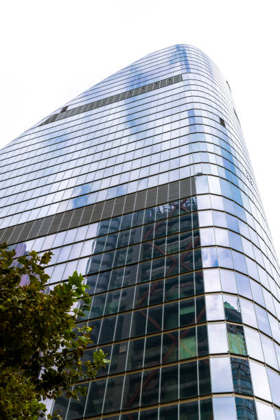 istock Low angle view of modern office building, background with copy space 2161828530