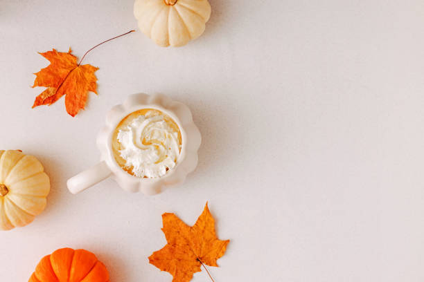 istock Pumpkin Spice Latte With Pumpkins And Fall Leaves On White Background 2161829354
