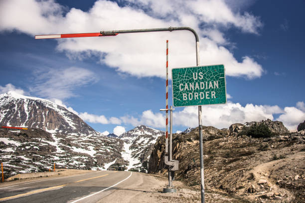 istock USA - Canada Border sign over Klondike Highway 2161832977