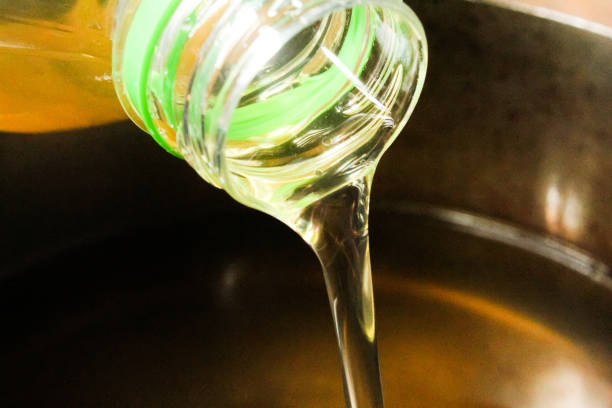 istock pour cooking oil from the bottle 2161836379