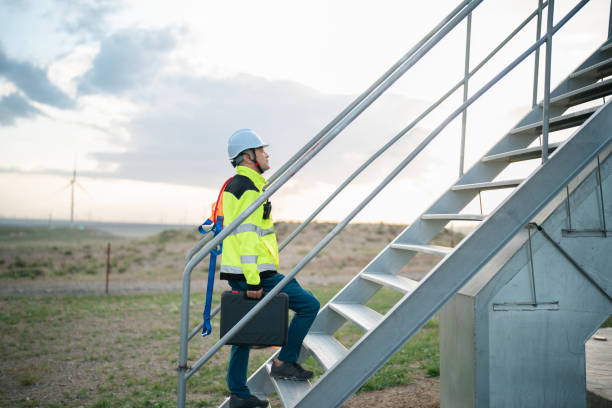 istock Middle-aged male electricity technician working at wind power station 2161839700
