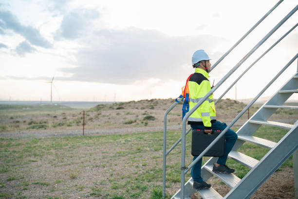 istock Middle-aged male electricity technician working at wind power station 2161839718