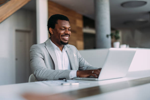 istock Successful businessman in modern office working on laptop. 2161842602