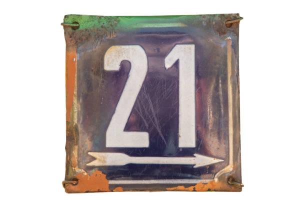 istock Enameled plate with number 21 on white 2161842702