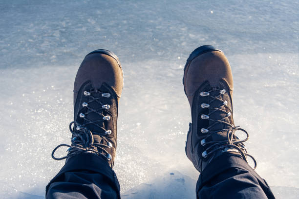 istock a man slipped on ice and fell, slippery road, ice 2161844322