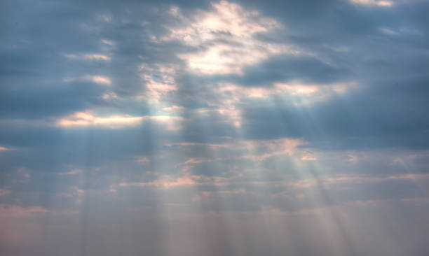 istock Amazing sun rays through the clouds at the beach 2161848888