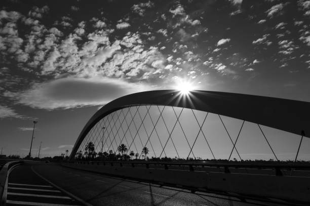Shadows on pedestrian bridge.\nKansas City, Missouri, USA