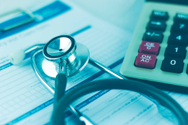 istock stethoscope and healthy claim form, with calculator 2161852877