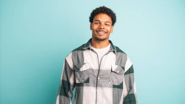 istock Happy young man in shirt looking at camera 2161861074