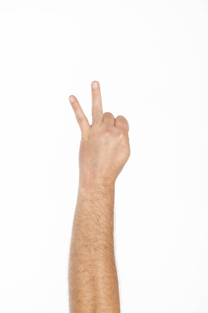 male hand making peace sign front of white background