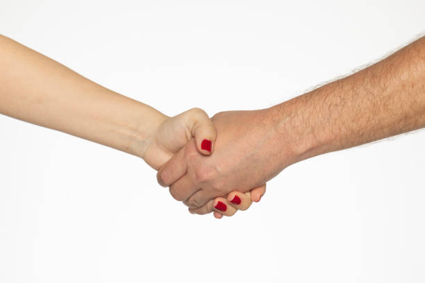 Male and female hands shaking hands