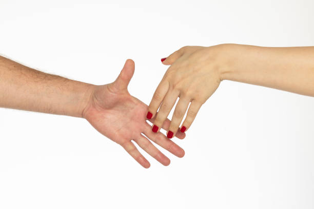 istock Man's hand gently holds woman's hand 2161861858