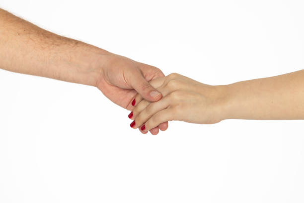 istock Man's hand gently holds woman's hand 2161861885