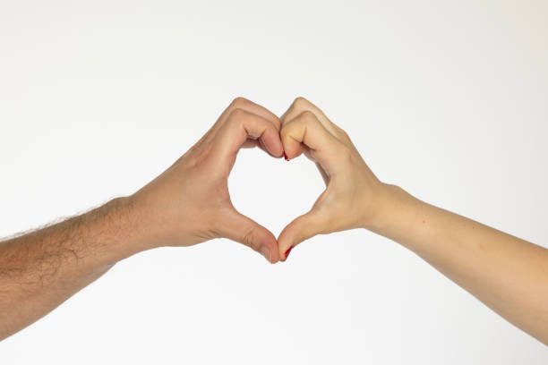 istock Man and woman hands making heart 2161862135