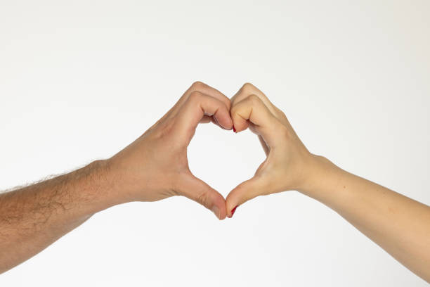 istock Man and woman hands making heart 2161862145