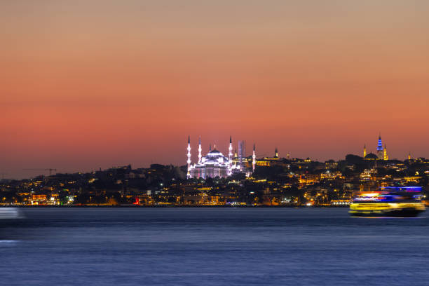 Blue Mosque with Istanbul cityscape at sunset.