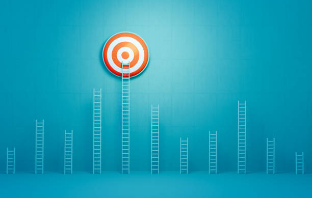istock Ladder Leaning Onto A Bull's Eye Target On Blue Background 2161863981