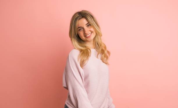 istock Happy woman shaking head in pink studio 2161864602