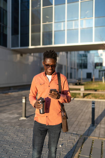 istock Young man using phone outdoors in the city 2161864686