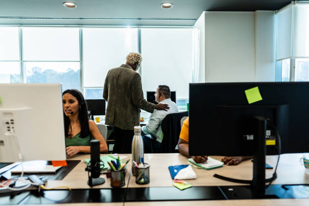 istock Boss talking with employee on call center on the office 2161870897