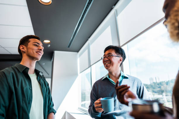 istock Coworkers talking on the office 2161871527
