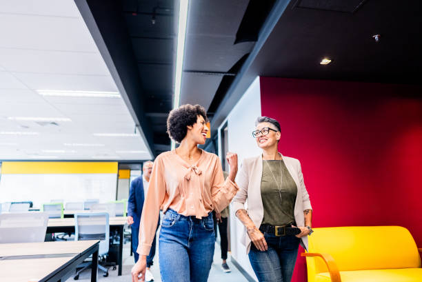 istock Coworkers talking and walking on the office 2161872114