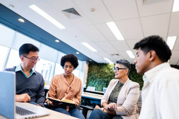 istock Coworkers talking on the office 2161872686