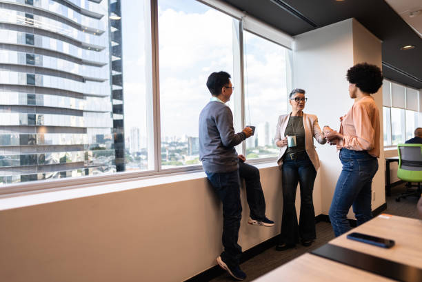 istock Coworkers talking on the office 2161872709