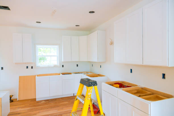 istock Custom kitchen cabinets are installed montage in kitchen during construction of a new house 2161873126