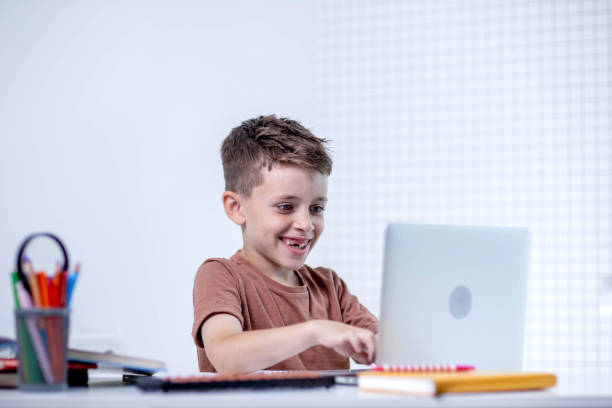 istock School kid with computer having video conference chat with teacher and class group. Child studying from home. Homeschooling. Modern gadgets for education. Screen time control. Online remote learning. 2161875911