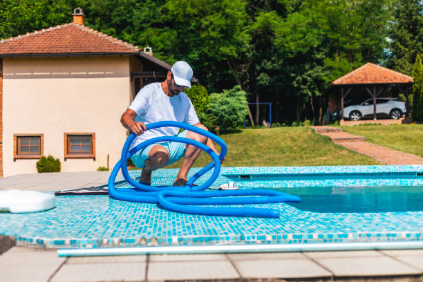 istock Man cleaning the swimming pool 2161882463