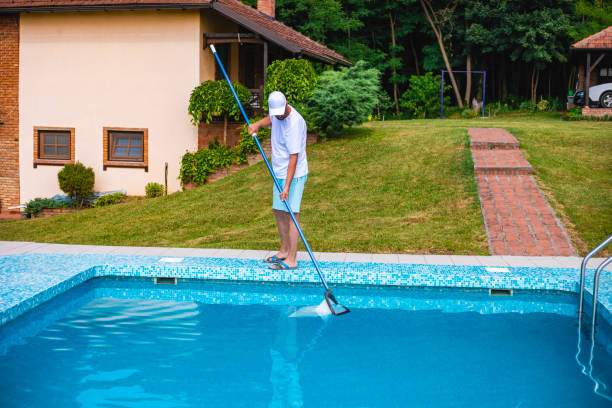 istock Man cleaning the swimming pool 2161882469