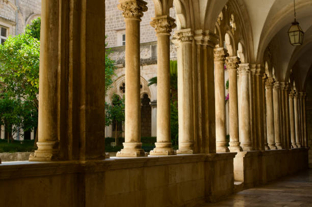 istock columns of stone lined up in low angled sunlight 2161883986