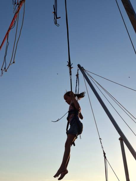 istock Girl is jumping on a bungee trampoline 2161885442
