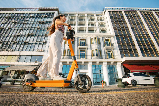 istock Riding electric scooter in a city 2161888335