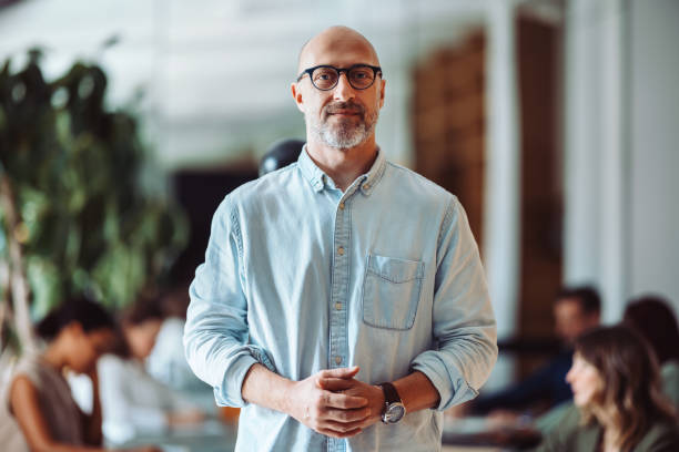 istock Confident Businessman Standing in Modern Office Environment 2161896266