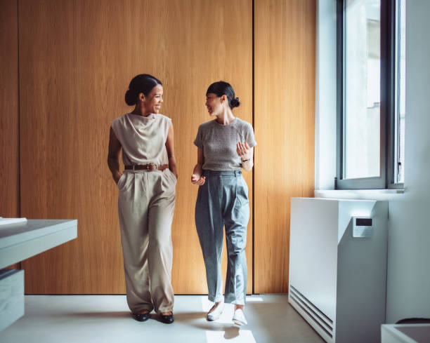 Friendly Colleagues Chatting During A Break In The Office