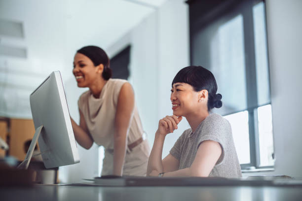istock Happy Colleagues Working Together in a Modern Office 2161896295
