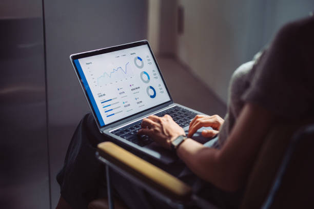 istock Businesswoman Analyzing Data on Laptop in Office Setting 2161896451