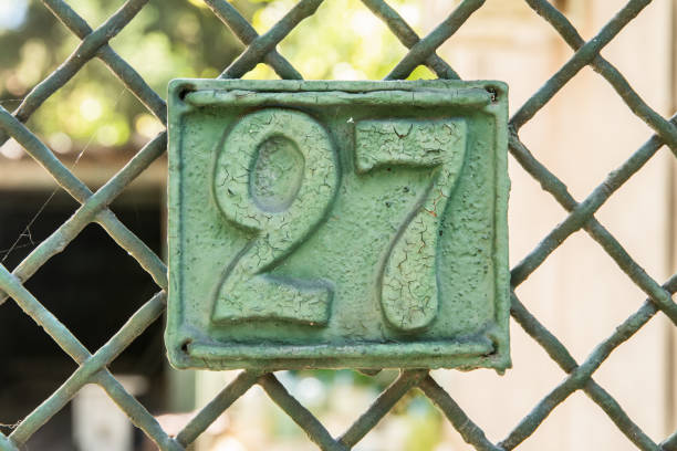 istock Weathered iron plate with number 27 2161897999
