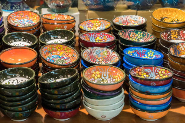 Traditional Asian oriental ceramic bowl plates, souvenir shop showcase on grand bazaar. Colorful dishes with Turkish floral decoration ornament.