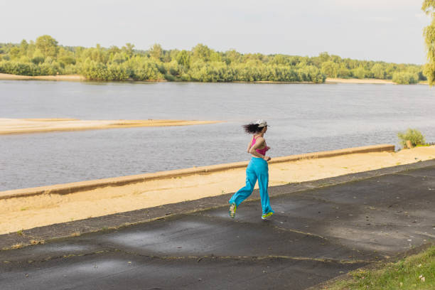 Woman running in park.