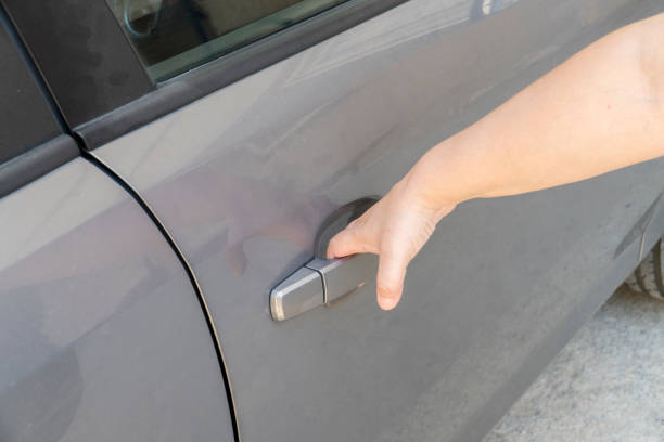 istock A hand opens the car door 2161901543