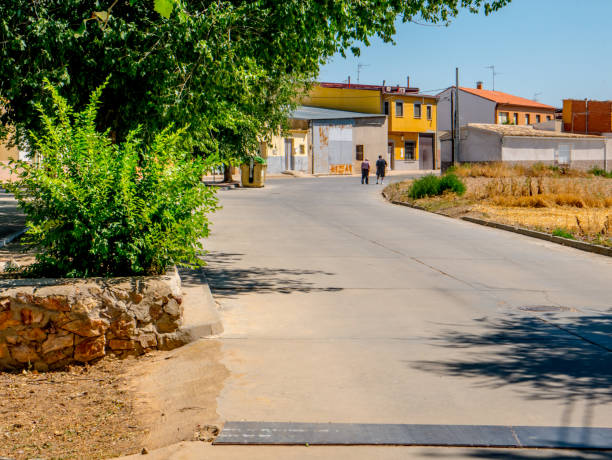 istock Two people walking through the streets of a town 2161902409