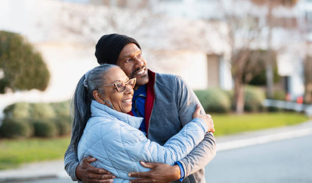 istock Senior African-American couple hugging, looking to side 2161902698