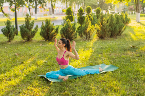 istock Active lifestyle. Yoga in park. 2161903318