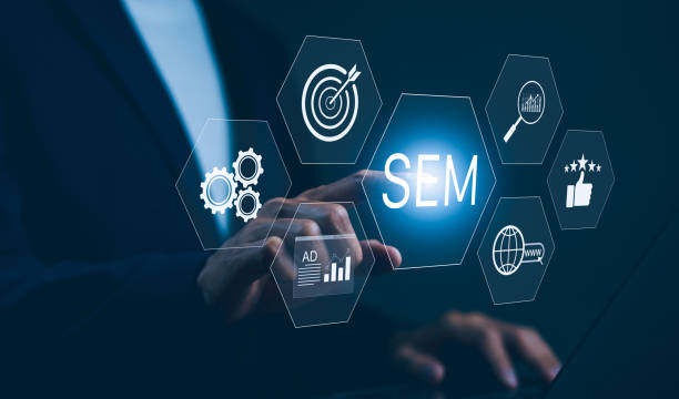 istock SEM Search Engine Marketing Concept. Businessman touching virtual icons representing search engine marketing, including target, analytics, gears, ads, and global reach, digital marketing strategies. 2161903578