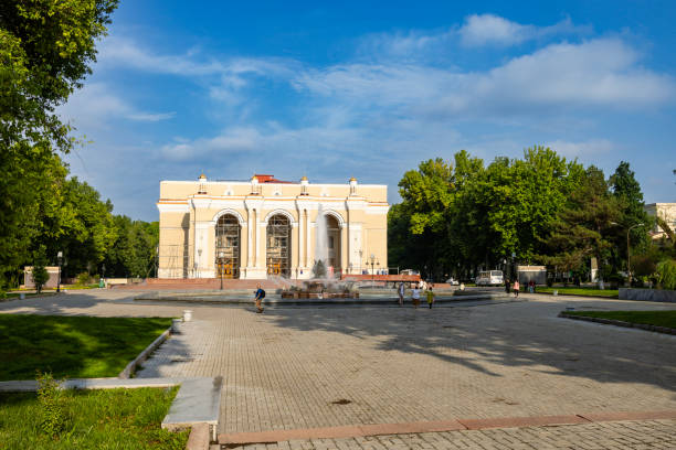 Tashkent, Uzbekistan. May 24th, 2024. People walking by the garden and fountain in front of the Alisher Navoy Theater in Tashkent