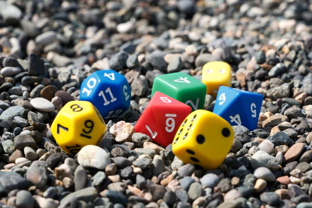 istock Colorful dice on the beach. Selective focus on dice. 2161904955